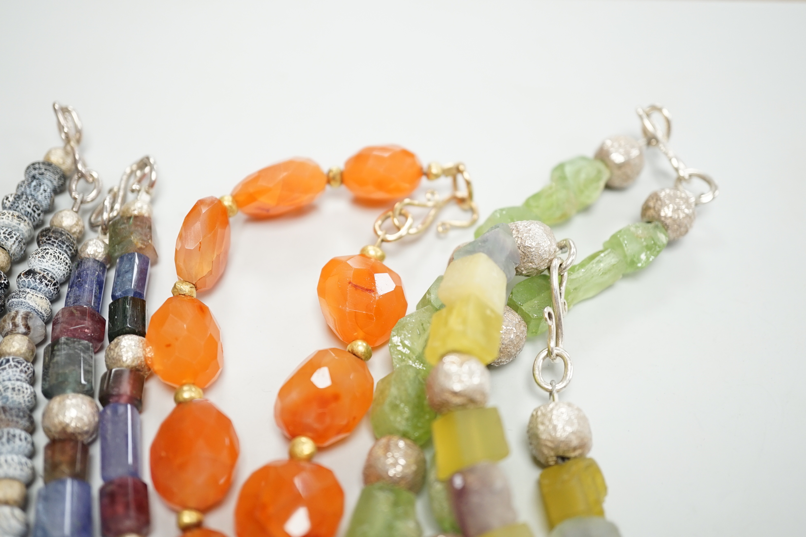 Five assorted Pruden & Smith silver and hardstone necklaces, largest 42cm and three other similar unsigned necklaces.